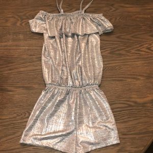 Metallic silver romper, sleeveless w/ straps. Elastic chest/waist. L girls